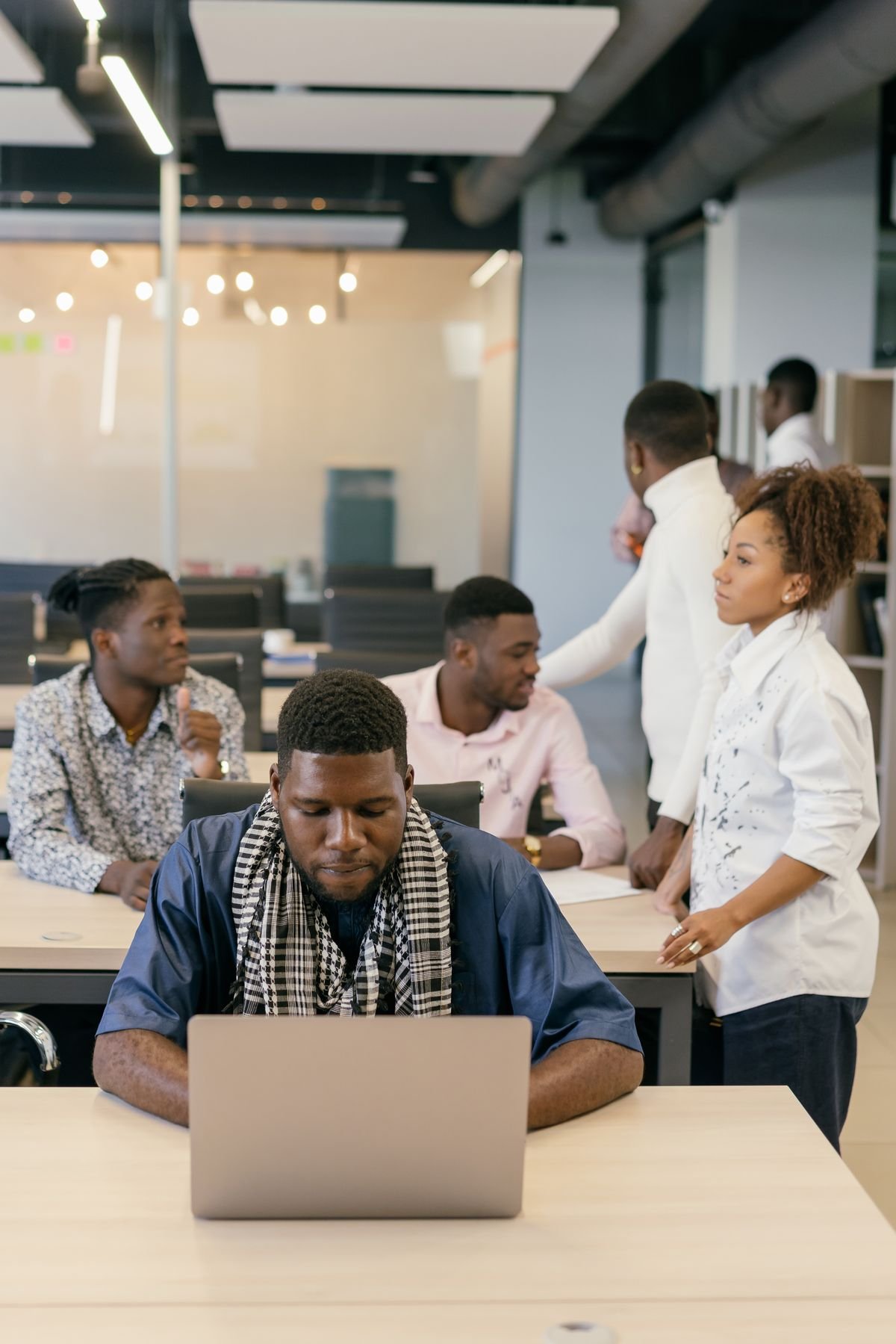 Young African digital professionals in a shared workspace